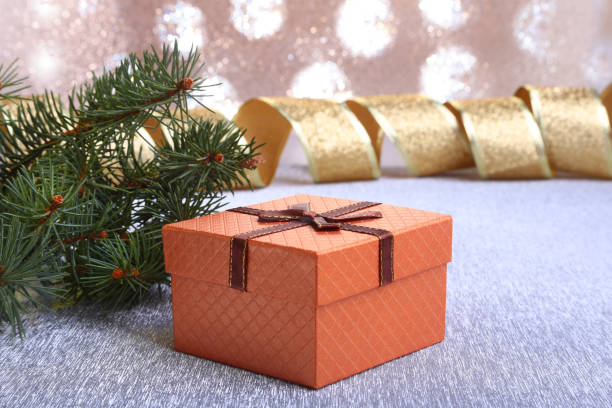 istock Christmas decoration with gift boxes and christmas tree on a blurry, sparkling and fabulous background. 1068515832