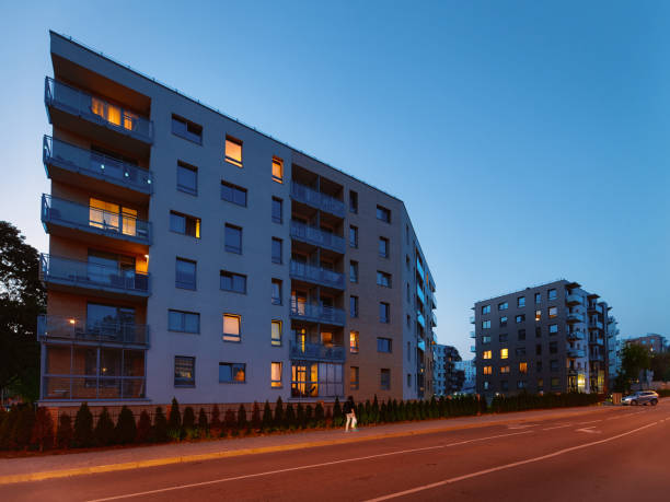 istock Modern apartment house building architecture outdoor night 1068515846