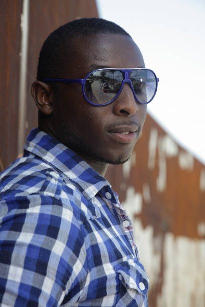 istock Young african man with sunglasses 1068517664