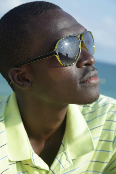 istock Young african man with sunglasses 1068517690