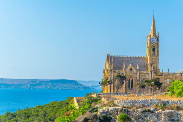 Church of Our lady of Lourdes in Mgarr, Gozo, Malta Church of Our lady of Lourdes in Mgarr, Gozo, Malta mgarr malta island gozo cityscape with harbor stock pictures, royalty-free photos & images