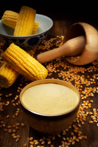 istock Sweet yellow corn and flour over rustic pine wood table 1068537958