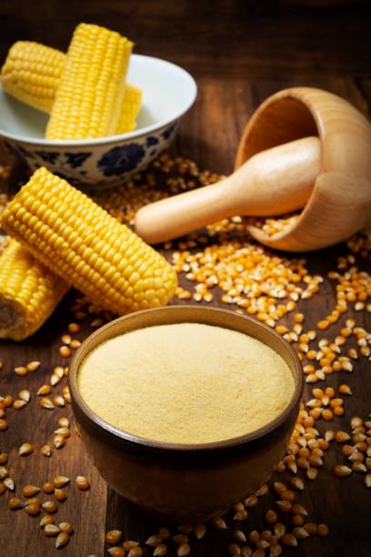 istock Sweet yellow corn and flour over rustic pine wood table 1068537986