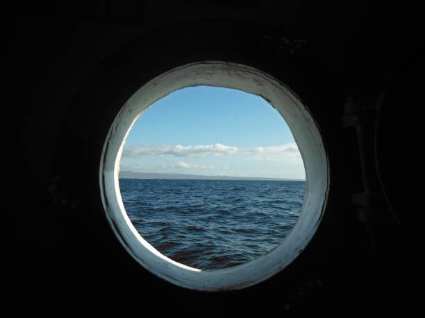 istock Looking at ocean through a porthole 1068538180