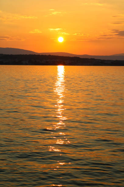istock Sunset and clouds near Malinska, Croatia 1068540592