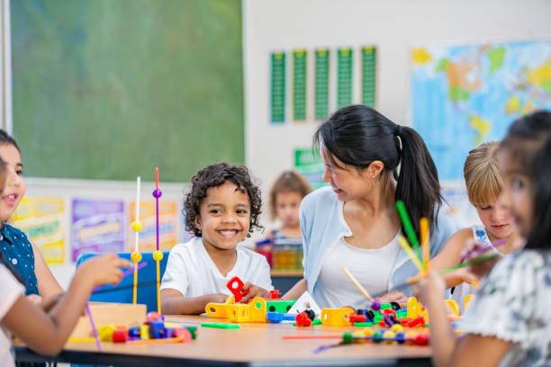 istock Kindergarten students with educational toys 1068540846