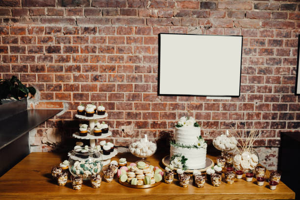 istock Wedding catering, table with modern desserts and cupcakes. 1068542508