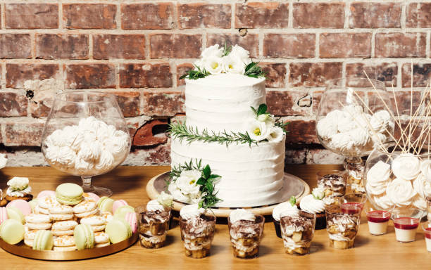 istock Wedding catering, table with modern desserts and cupcakes. 1068542542