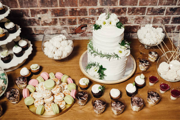 istock Wedding catering, table with modern desserts and cupcakes. 1068542556