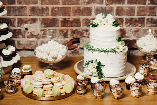 istock Wedding catering, table with modern desserts and cupcakes. 1068542562