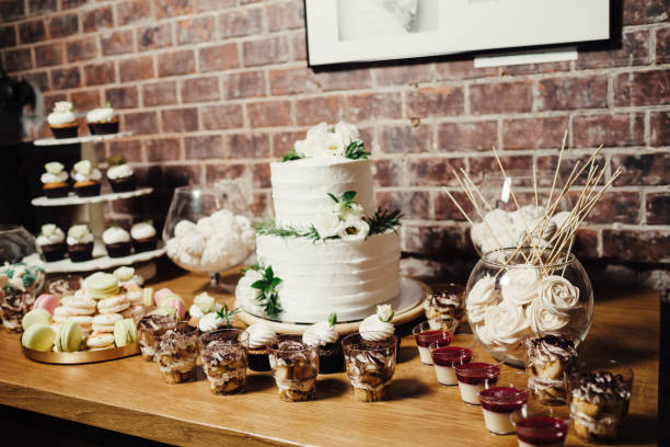 istock Wedding catering, table with modern desserts and cupcakes. 1068542568