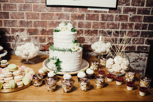 istock Wedding catering, table with modern desserts and cupcakes. 1068542596
