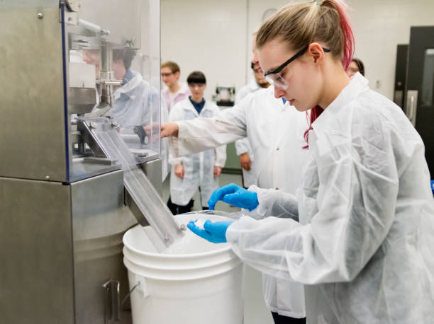 istock Group of students in College pharmaceutical laboratory. 1068545528