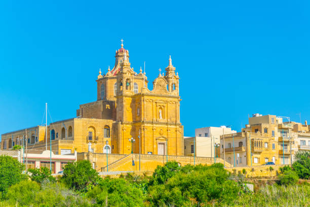 Church of Our lady of Lourdes in Mgarr, Gozo, Malta Church of Our lady of Lourdes in Mgarr, Gozo, Malta mgarr malta island gozo cityscape with harbor stock pictures, royalty-free photos & images