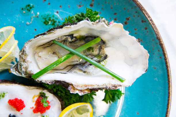 istock Fresh oysters with red and black caviar 1068554772