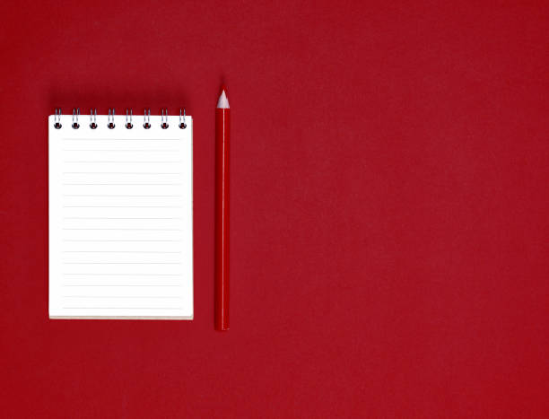 istock notebook with empty white sheets in line and red wooden pencil 1068560460