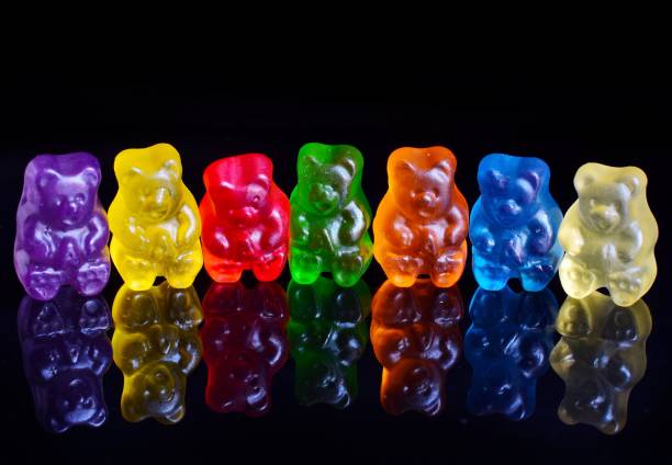 istock Close-Up Of Multi Colored Gummi Bears Against Black Background 1068569574