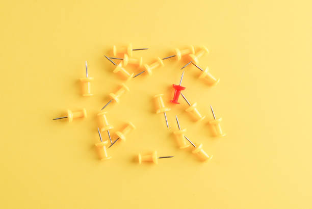 istock Yellow pushpins. Pushpins on yellow. 1068572610