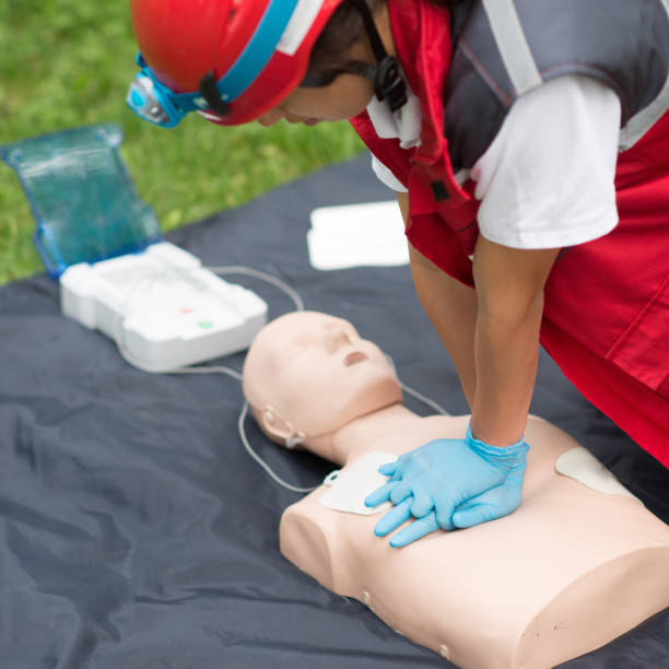istock Healthcare Worker Practicing On Cpr Dummy At Park 1068574472