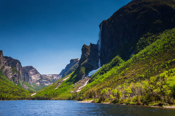 istock Water falls and snow on the pond, Gros Morne 1068593664