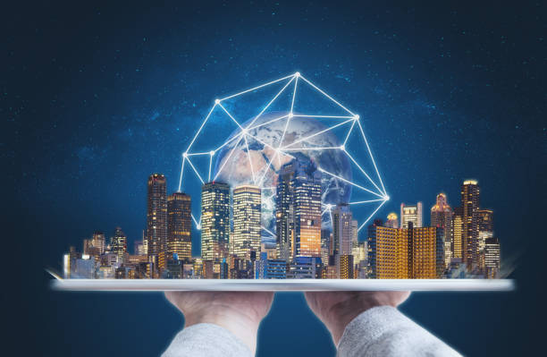 istock Hands holding digital tablet with modern buildings global network connection technology hologram. Element of this image are furnished by NASA 1068595882