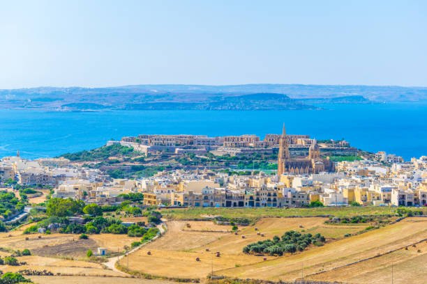 Aerial view of Mgarr on Gozo, Malta Aerial view of Mgarr on Gozo, Malta mgarr malta island gozo cityscape with harbor stock pictures, royalty-free photos & images
