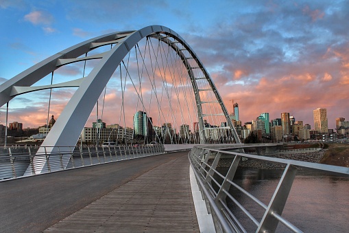 Walking across the Walterdale Bridge in Edmonton towards downtown at sunset.