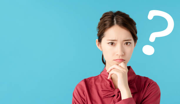 thinking asian woman. - tough choices imagens e fotografias de stock