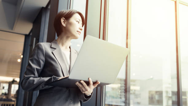 Middle aged businesswoman using a laptop computer.