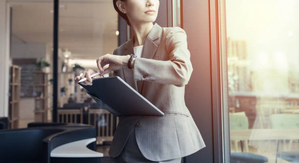 Attractive businesswoman holding a tablet PC.