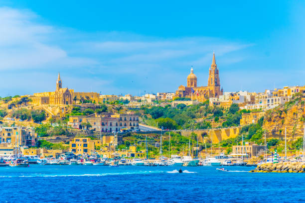 Seaside view of Mgarr on Gozo island, Malta Seaside view of Mgarr on Gozo island, Malta mgarr malta island gozo cityscape with harbor stock pictures, royalty-free photos & images