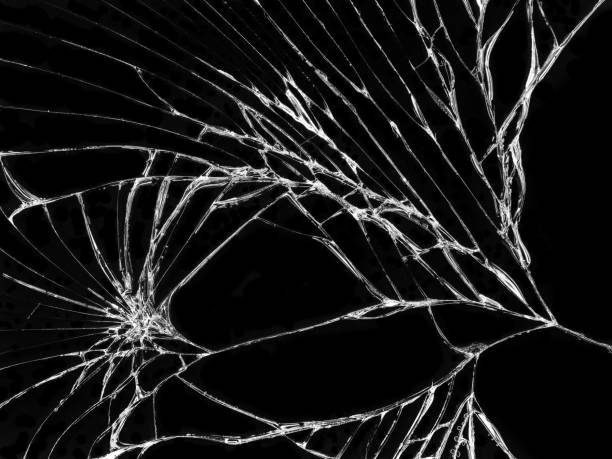istock Cracked glass texture on black background 1068622556