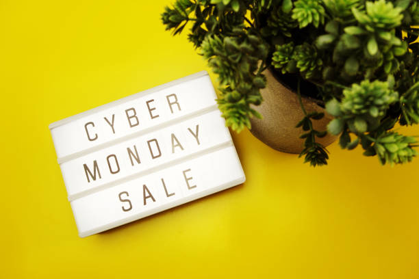 istock cyber monday sale flat lay top view on yellow background 1068625848