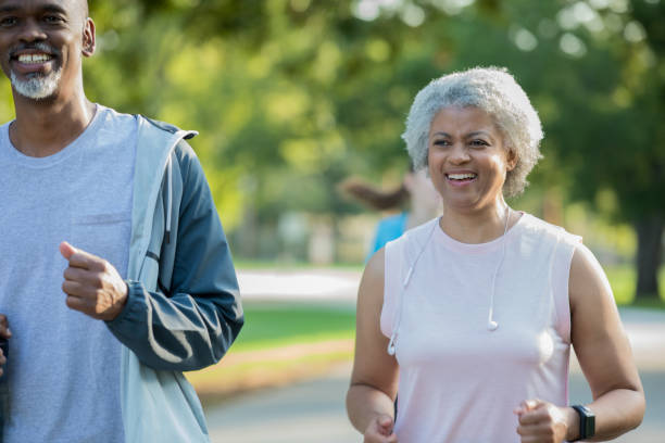 istock Active seniors running together outdoors in park 1068627432