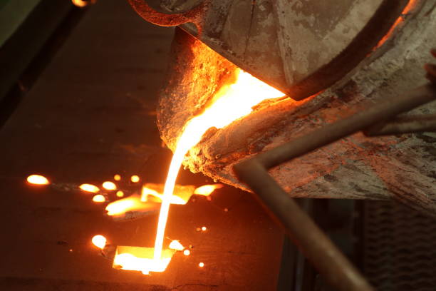 istock Iron molten metal pouring in sand mold 1068629436