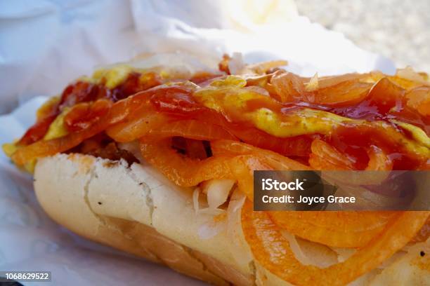 Closeup Of Messy Hot Dog Filled With Toppings Stock Photo - Download Image Now - Nathan's Famous, Hot Dog, American Culture