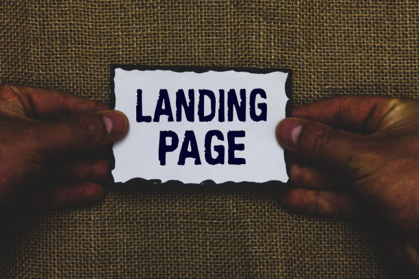 istock Handwriting text Landing Page. Concept meaning Website accessed by clicking a link on another web page Man holding piece paper black borders jute background Communicate ideas. 1068629738