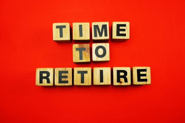 istock time to retire word created with cubes alphabet letters on blue background 1068630050