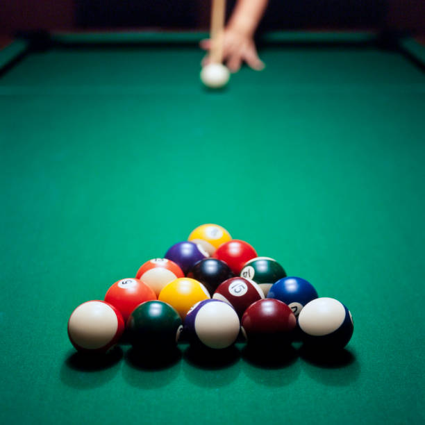 Adult male playing pool, snooker or billiard stock photo
