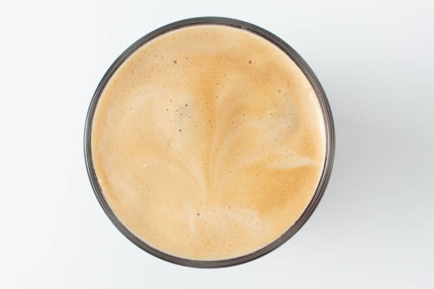 istock Coffee with frothy foam  top view closeup isolated on white background. 1068635406