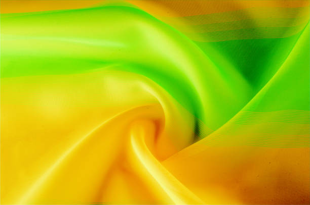 istock Texture, background, pattern. Silk fabric is transparent, dark orange, dark red, dark green, saturated colors. 1068635582