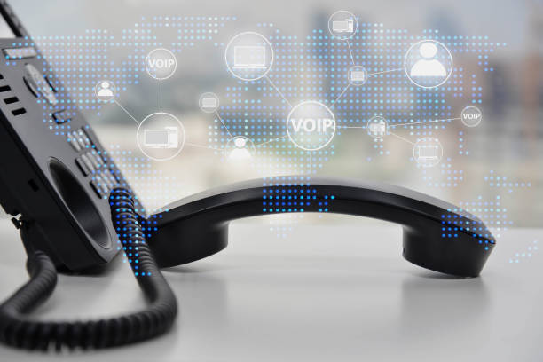 ip phone double exposure with blue led world map and business icon of voip human and  for communication concept - chamada de fotografia imagens e fotografias de stock