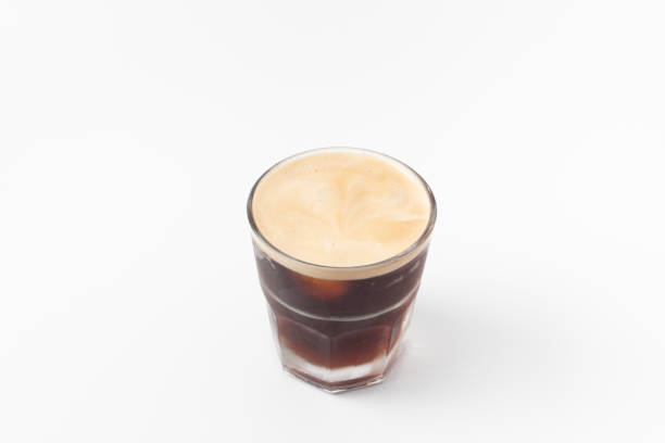 istock Coffee with frothy foam isolated on white background. 1068637568