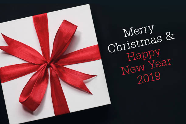 istock Christmas gift box with greeting card. 1068638920