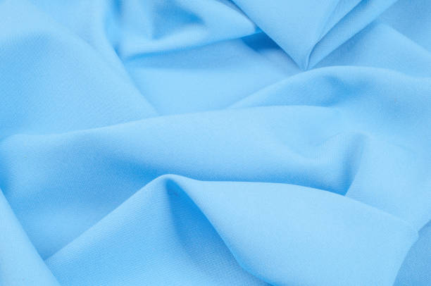 istock Texture, background, pattern. Fabric silk blue. 100% pure silk Duppies in a blue peacock. This fabric has a beautiful luster and fine drapery. 1068644442