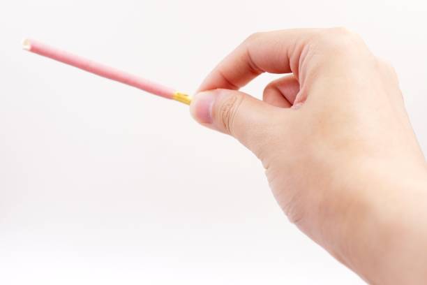 istock Biscuit sticks coated with strawberry flavour confectionery 1068646512