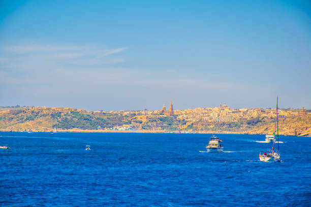 Seaside view of Mgarr on Gozo island, Malta Seaside view of Mgarr on Gozo island, Malta mgarr malta island gozo cityscape with harbor stock pictures, royalty-free photos & images