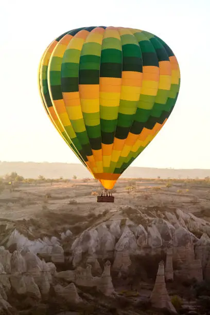Color balloon. Hot air balloon over mountain landscape. Cappadocia, Turkey.