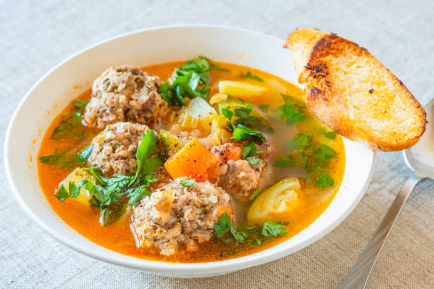 istock Mexican soup with meatballs and vegetables in a plate on a rustic background - Albondigas 1068651962