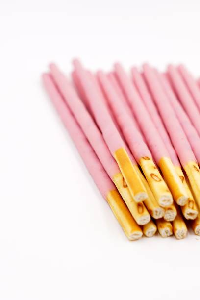 istock Biscuit sticks coated with strawberry flavour confectionery 1068655980
